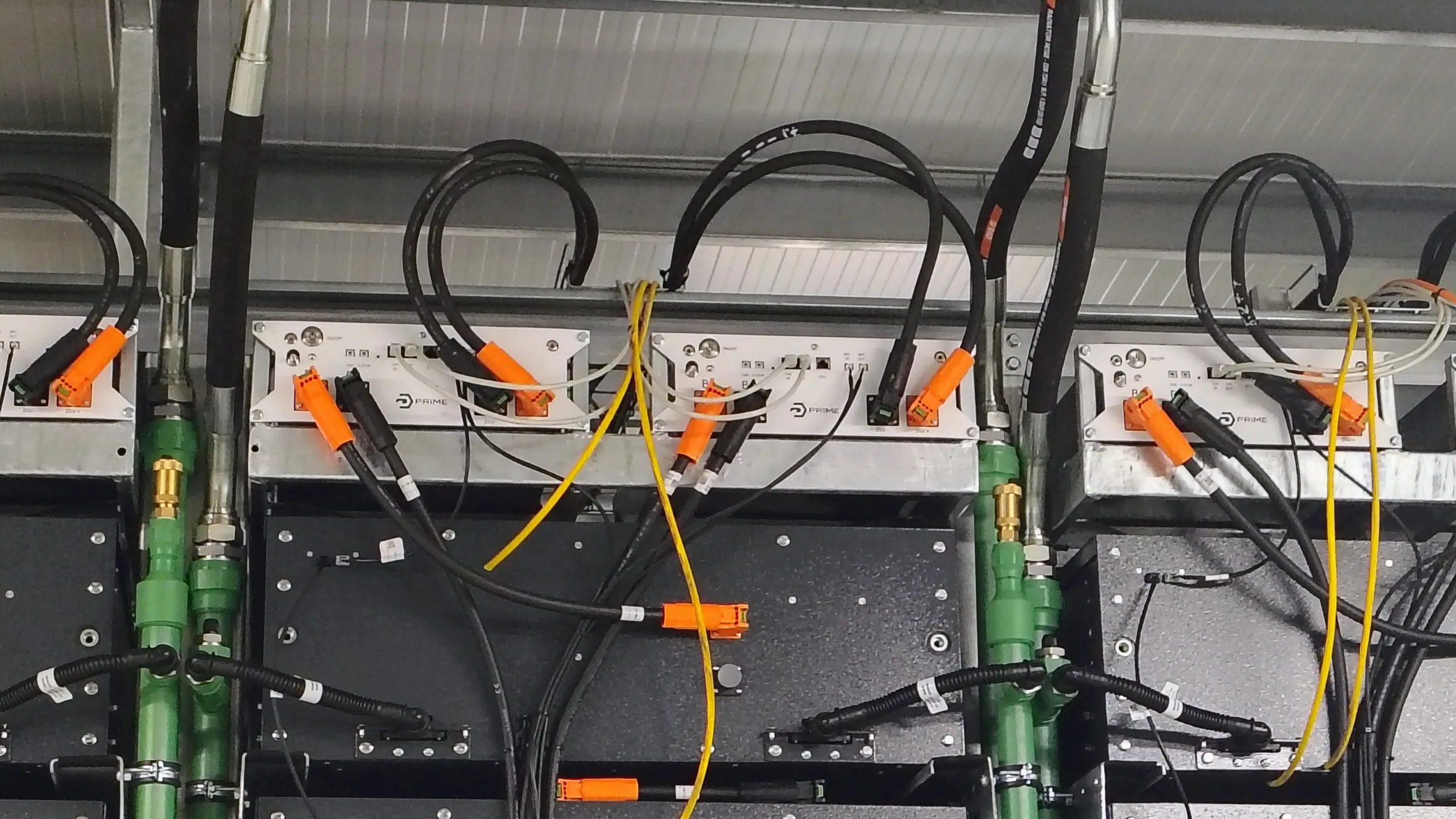 Prime Batteries engineers working on a battery energy storage system at the Cernica facility